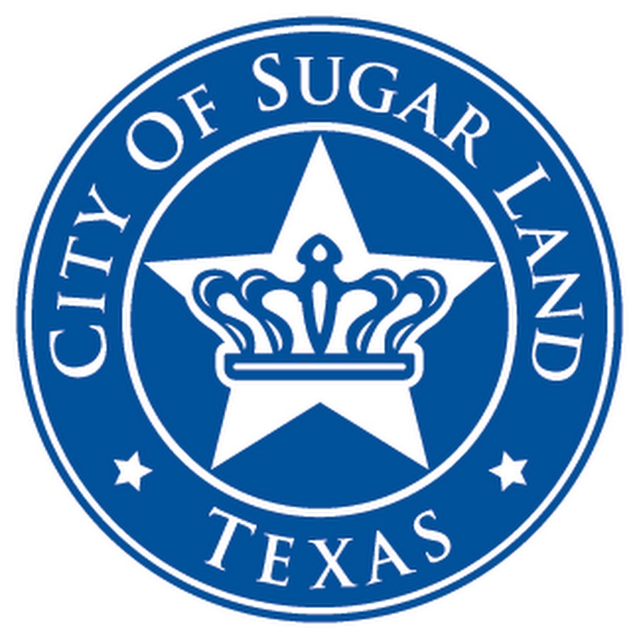 Seal of the City of Sugar Land, Texas, featuring a white star with a crown in the center on a blue circular background.