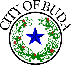Seal of the City of Buda featuring a blue star centered within a green wreath with red accents and the text 'CITY OF BUDA' above.